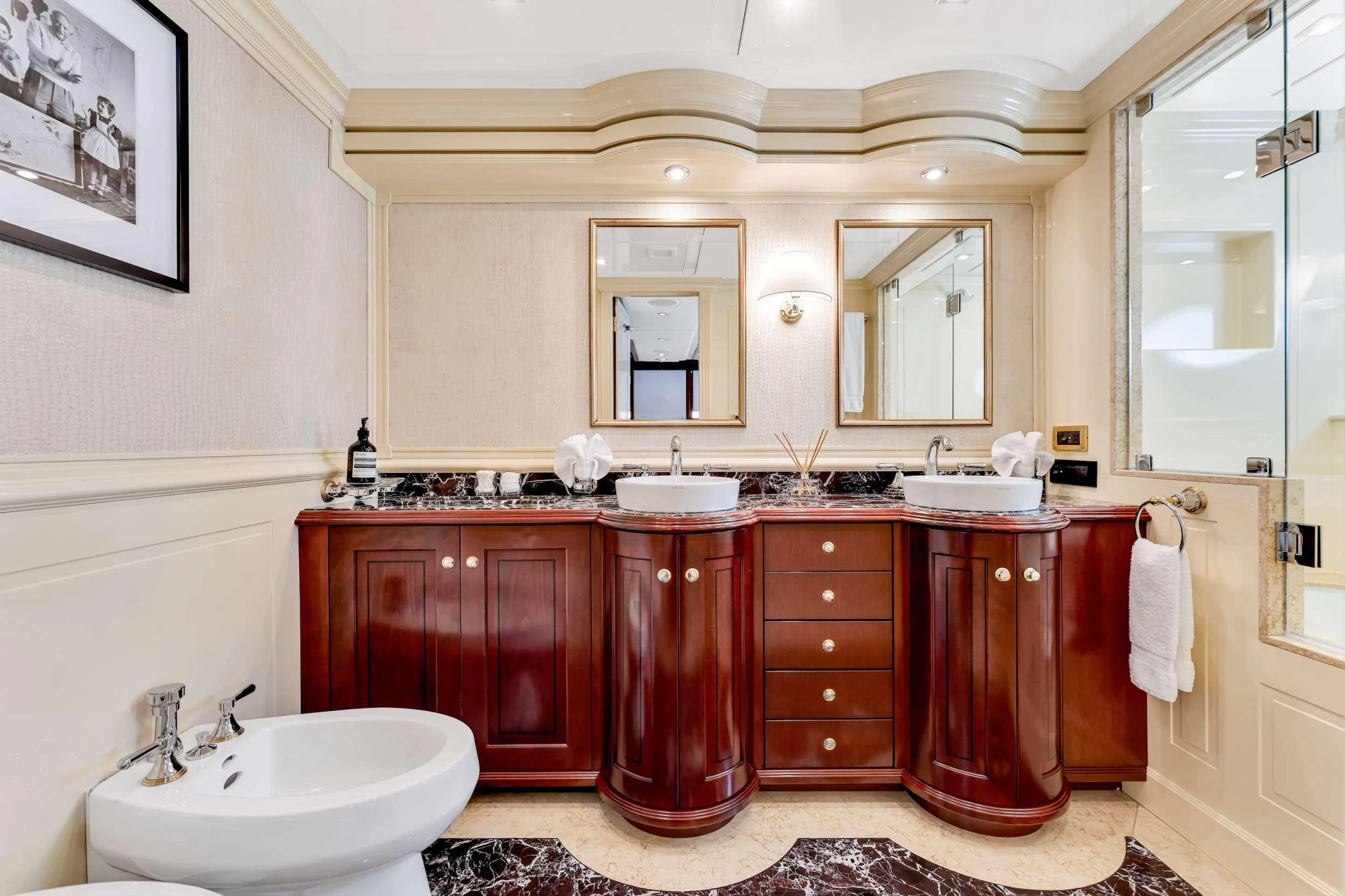 a bathroom with a sink and a mirror aboard SWEET CAROLINE II Yacht for Charter