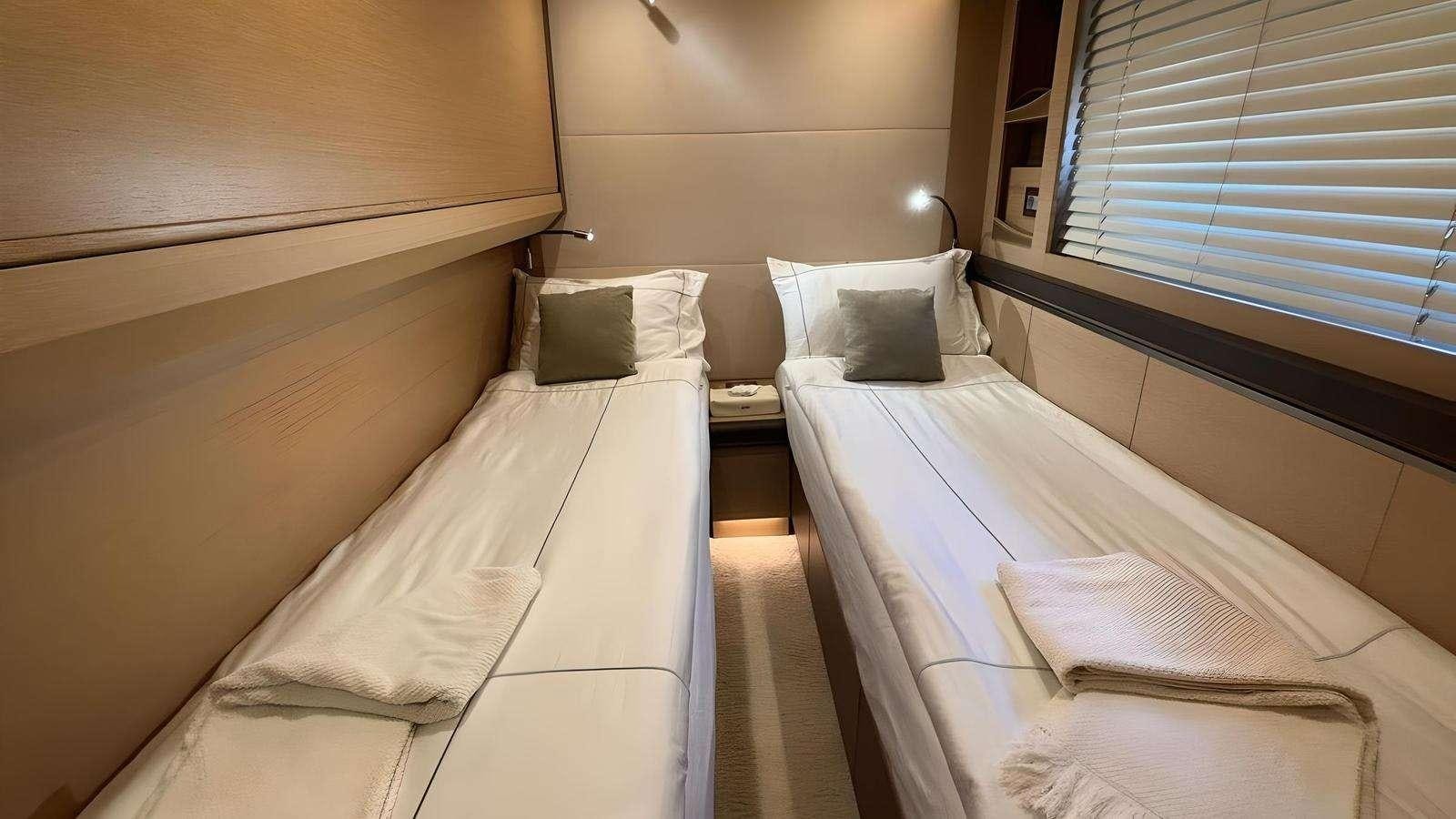 a room with two beds aboard NAYLA Yacht for Charter