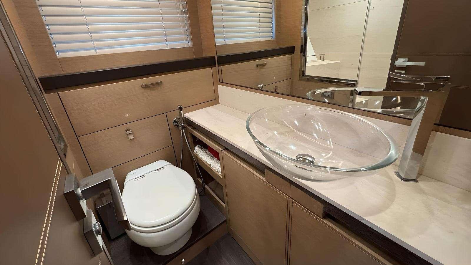 a bathroom with a sink and a toilet aboard NAYLA Yacht for Charter