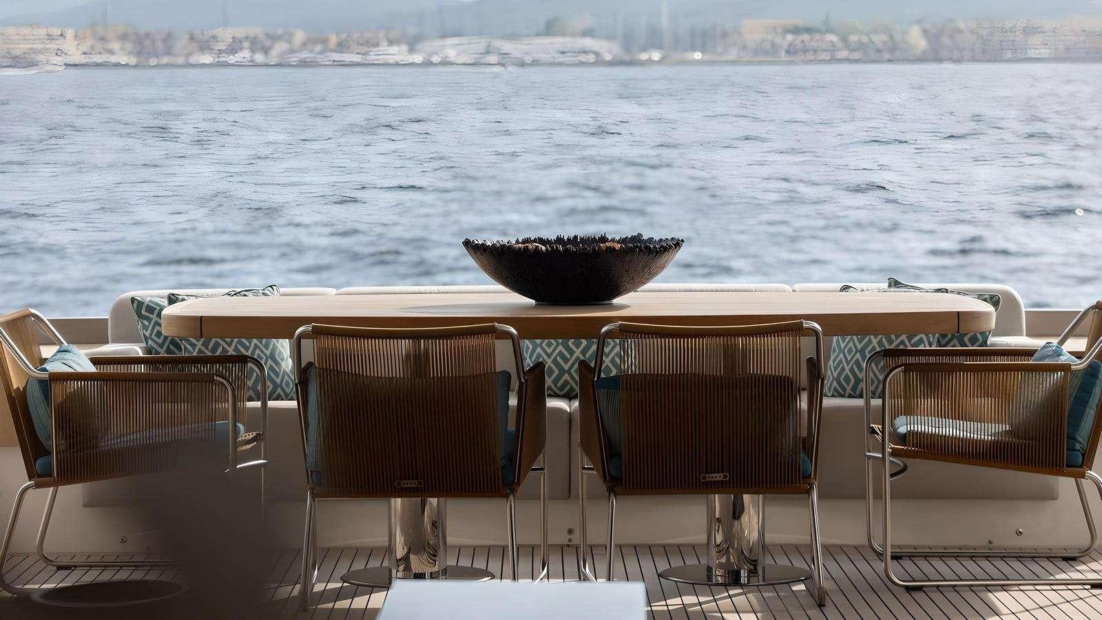 a table and chairs on a boat aboard NAYLA Yacht for Charter