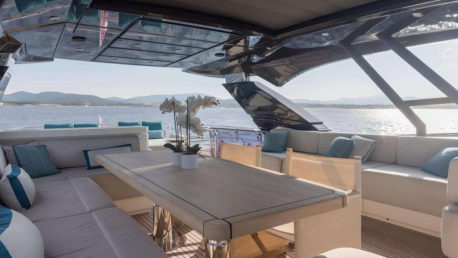 a room with a table and chairs aboard NAYLA Yacht for Charter