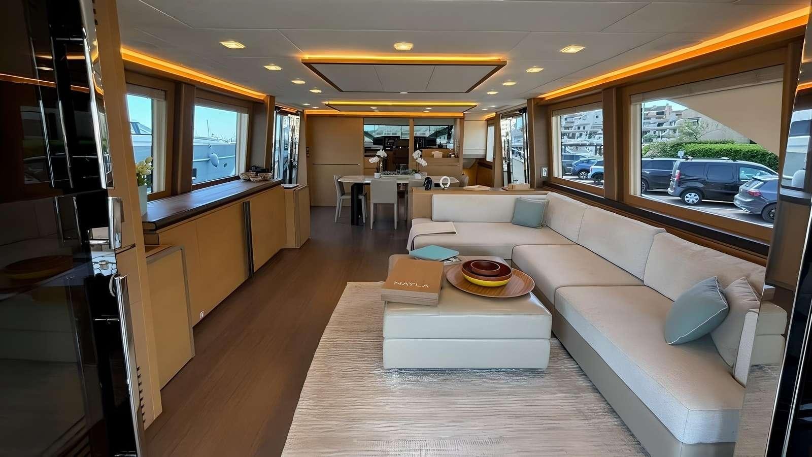 a living room with a couch and a table aboard NAYLA Yacht for Charter