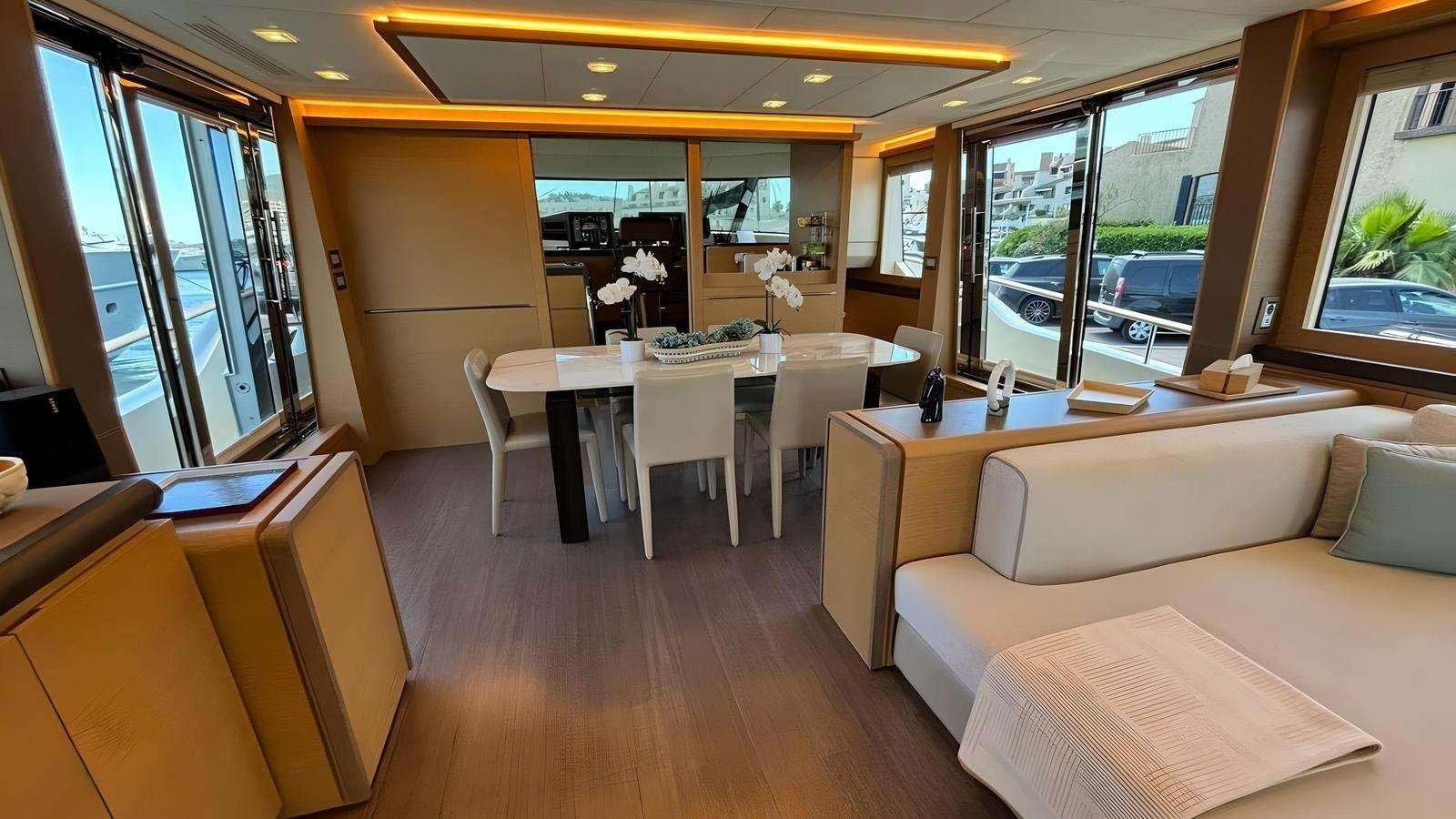 a room with a table and chairs aboard NAYLA Yacht for Charter