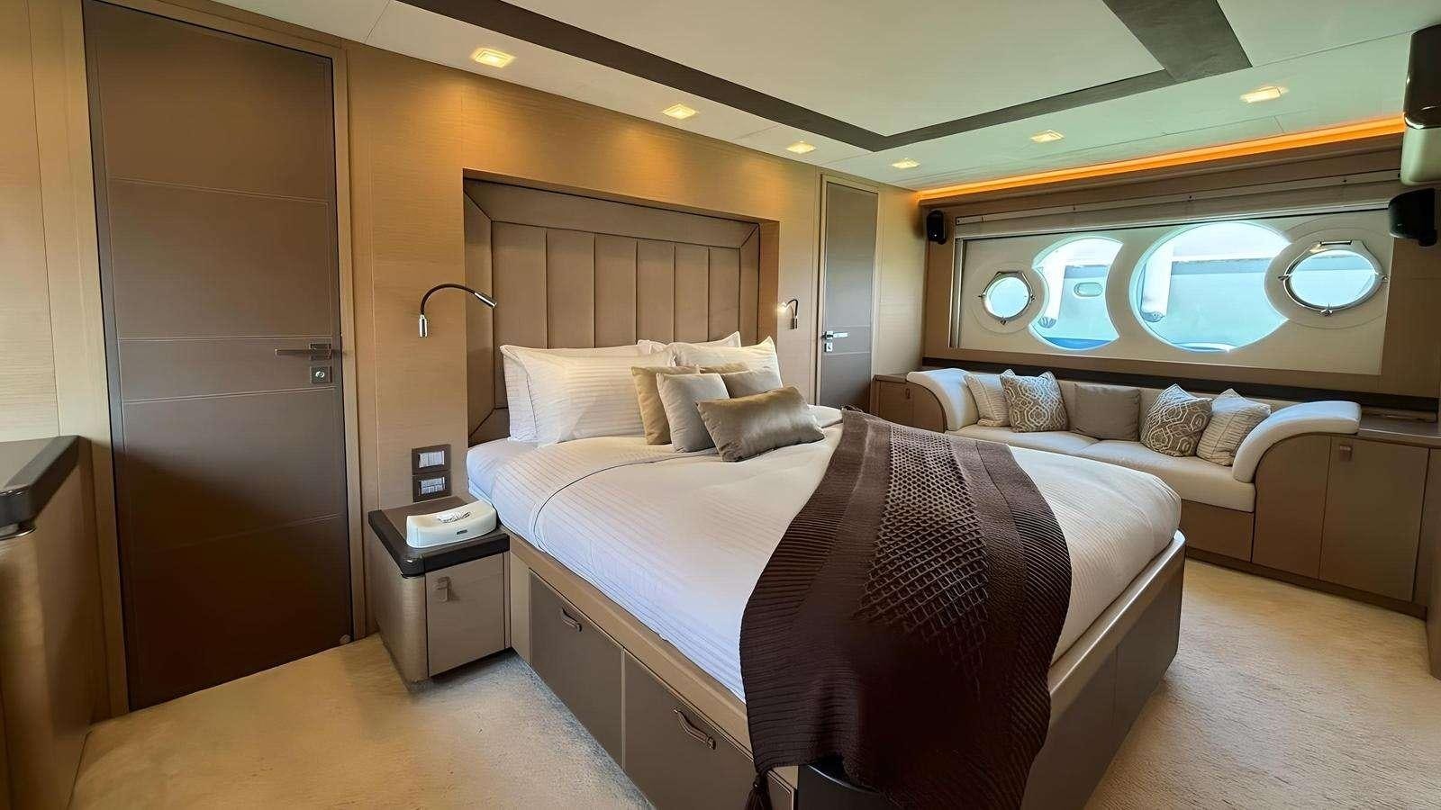 a hotel room with two beds aboard NAYLA Yacht for Charter