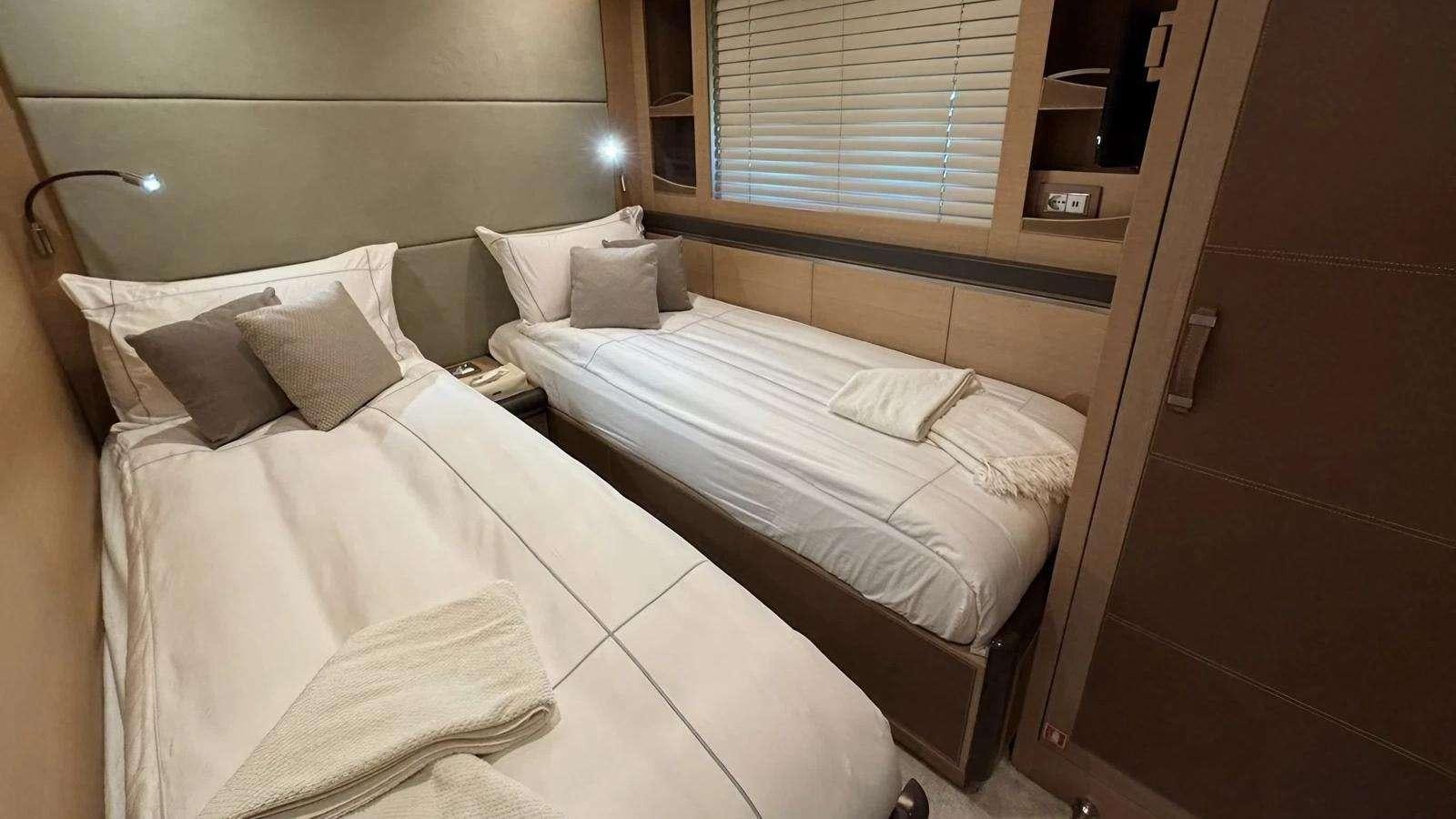 a couple of beds in a room aboard NAYLA Yacht for Charter