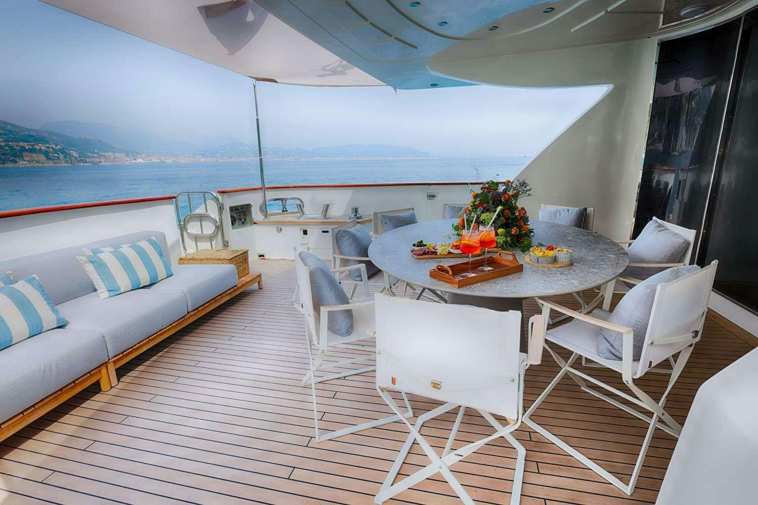 a room with a table and chairs aboard DEAONE Yacht for Charter