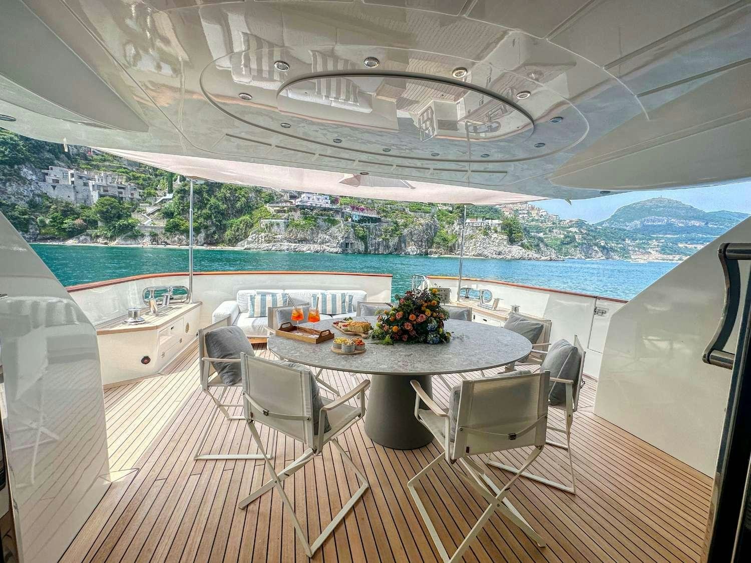 a room with a table and chairs aboard DEAONE Yacht for Charter