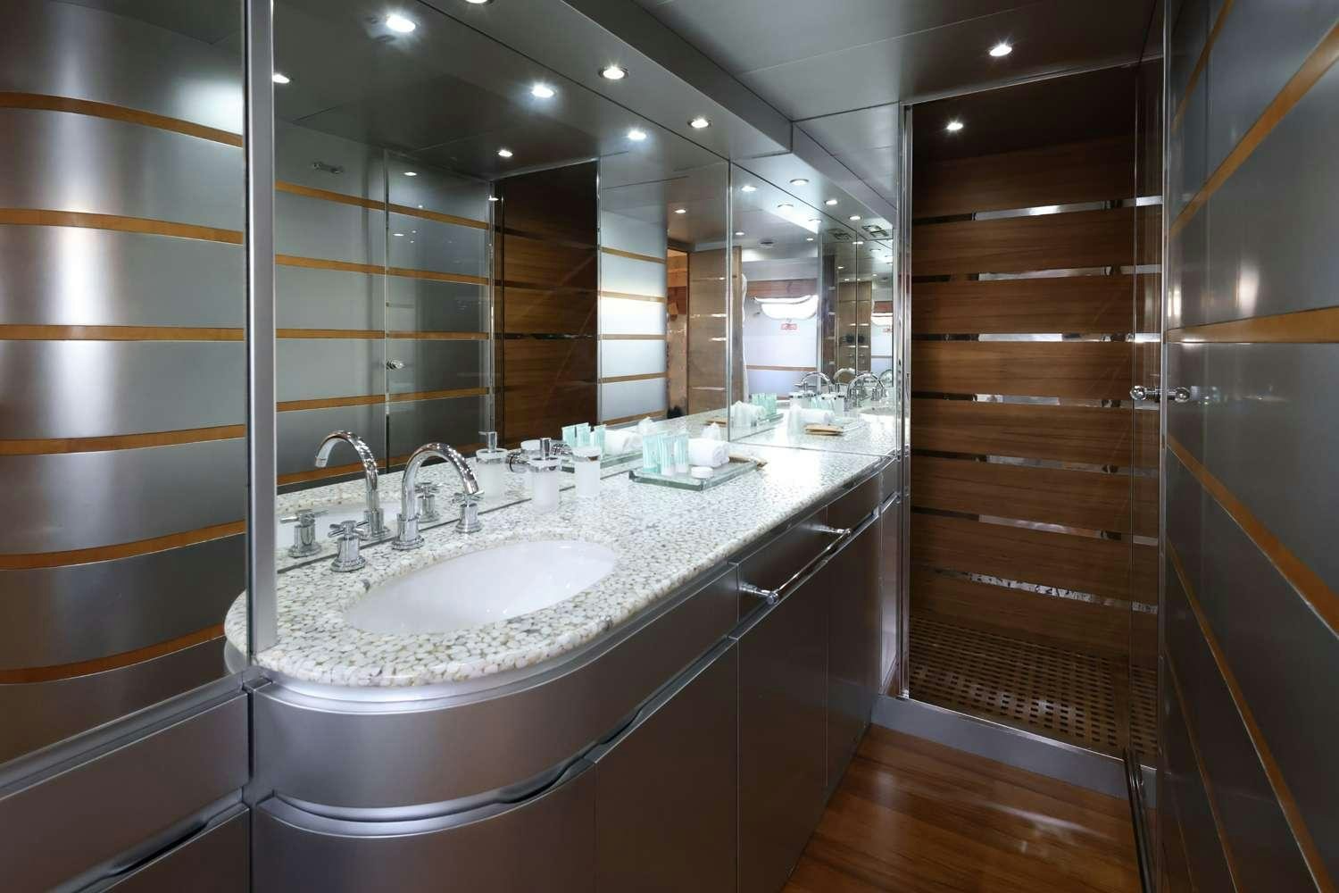 a bathroom with a large mirror aboard DEAONE Yacht for Charter