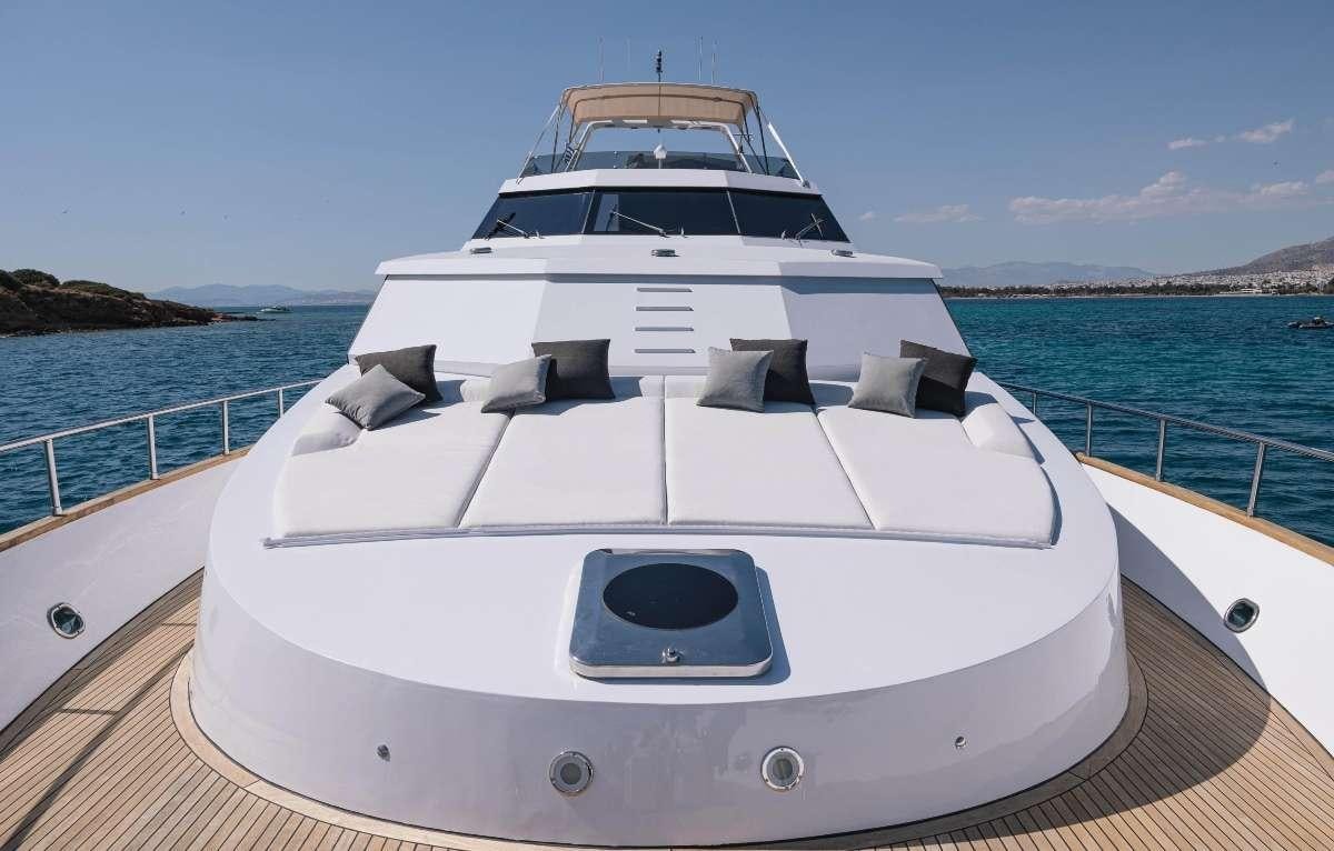 a white boat on a dock aboard CARI&NTILDE;O Yacht for Charter