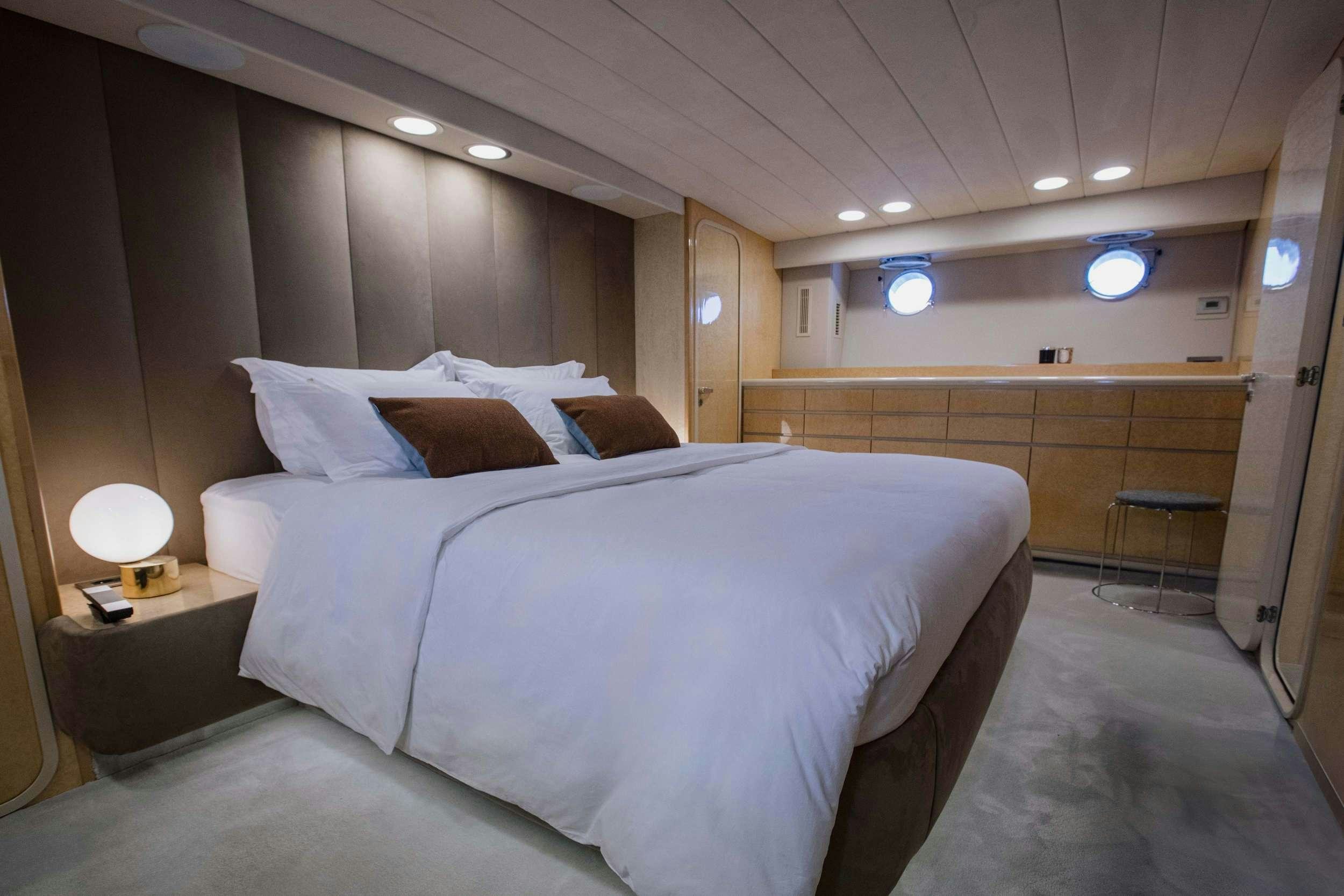 a bed in a room aboard CARI&NTILDE;O Yacht for Charter