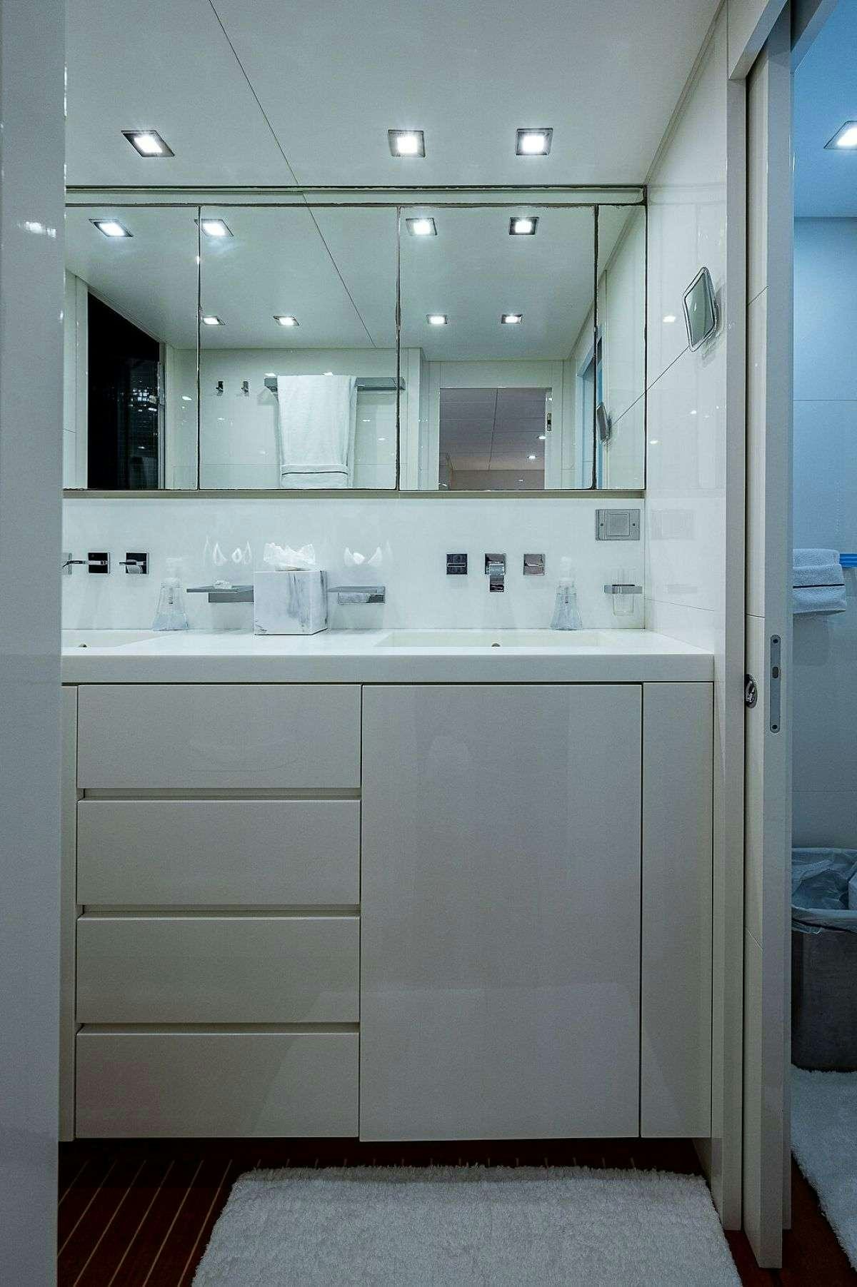 a bathroom with a mirror aboard CASSINELLA Yacht for Charter