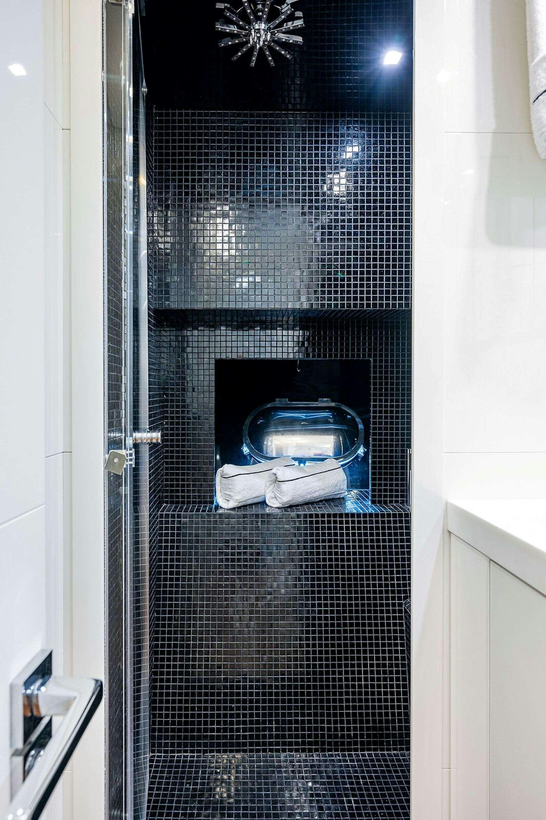 a blue and white towel in a black cage aboard CASSINELLA Yacht for Charter