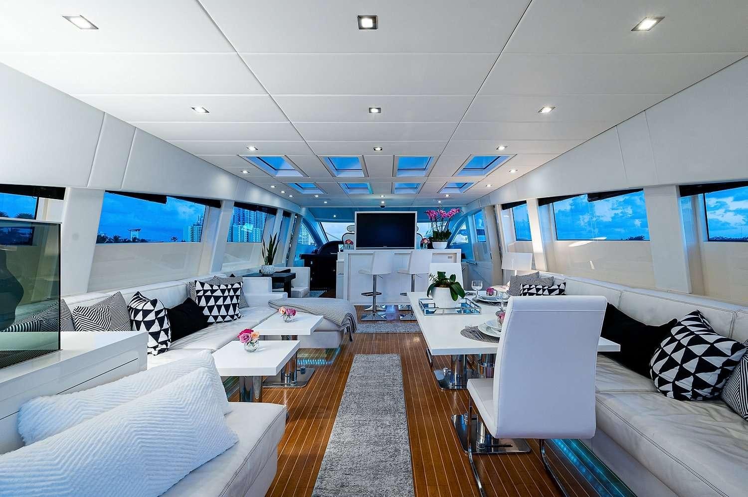 a room with a couch and a tv aboard CASSINELLA Yacht for Charter