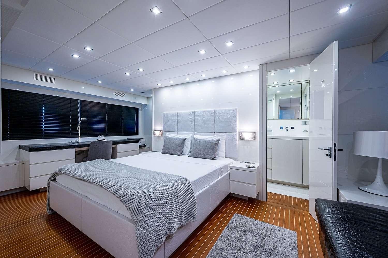 a large bedroom with a large bed aboard CASSINELLA Yacht for Charter