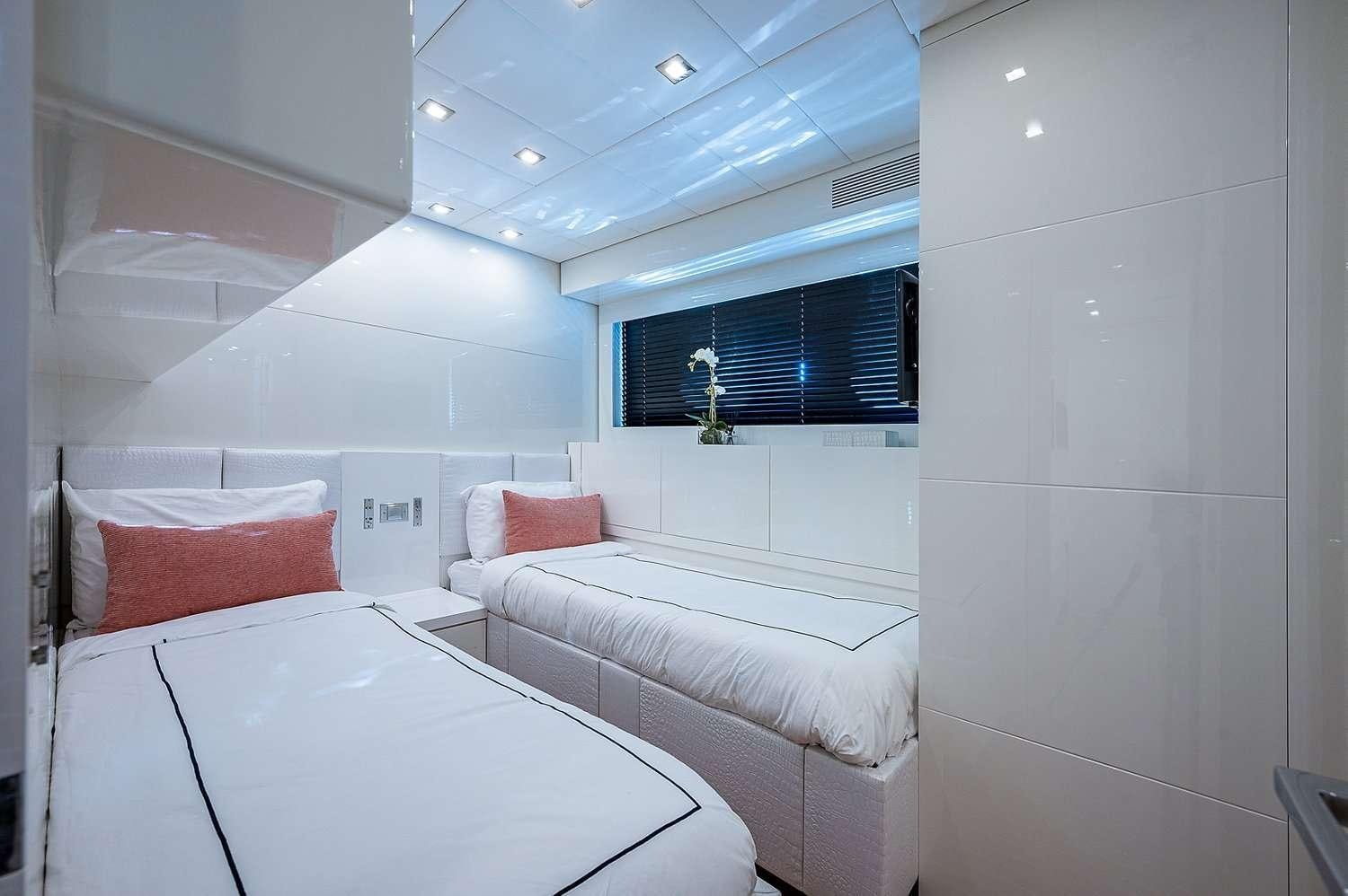 a couple of beds in a room aboard CASSINELLA Yacht for Charter