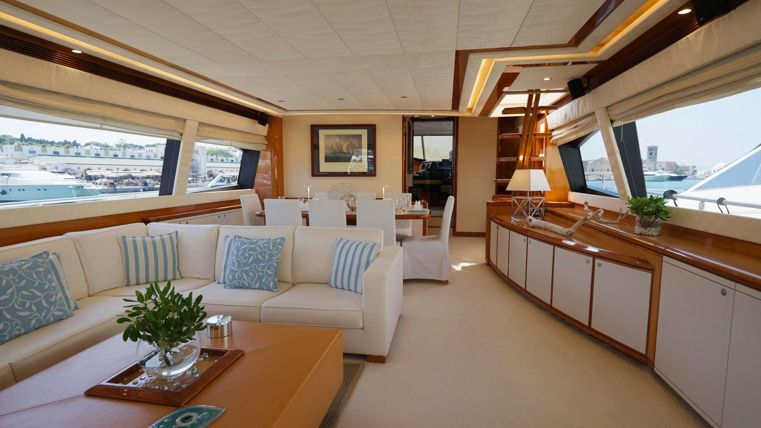 a living room with a couch and a table aboard NATASSA ( EX LADY NATASA) Yacht for Charter