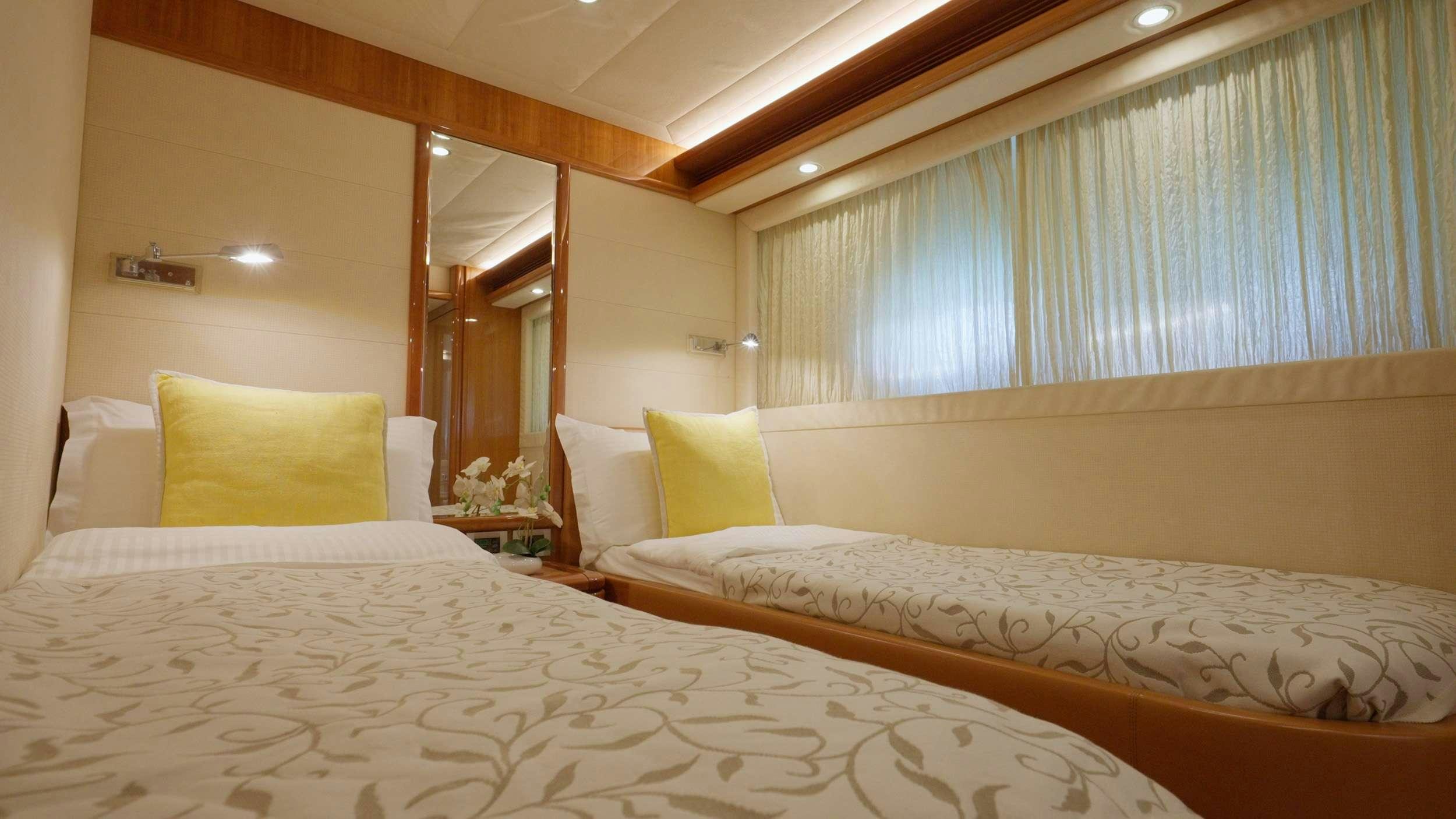 a room with two beds aboard NATASSA ( EX LADY NATASA) Yacht for Charter