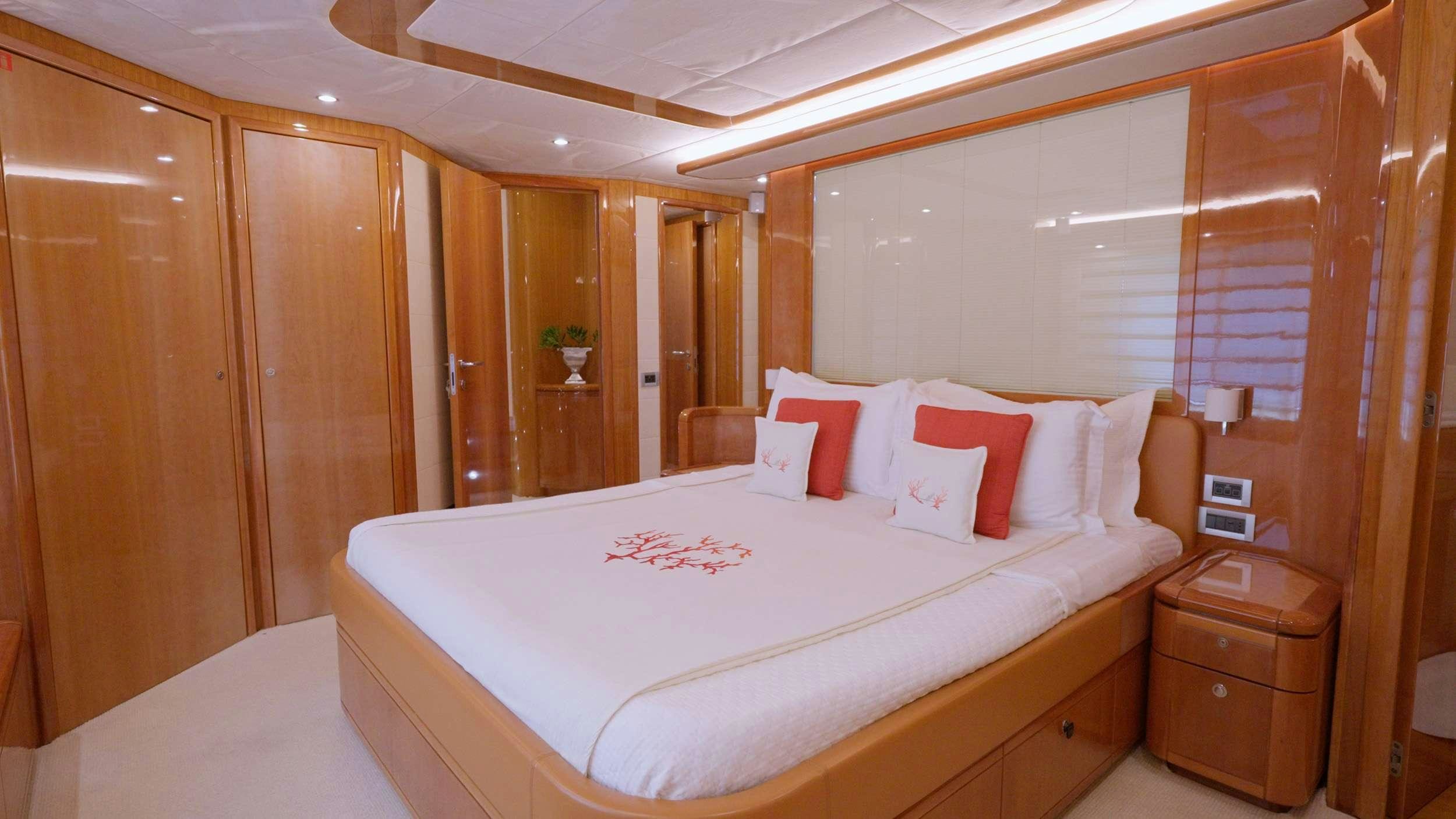 a bed in a room aboard NATASSA ( EX LADY NATASA) Yacht for Charter