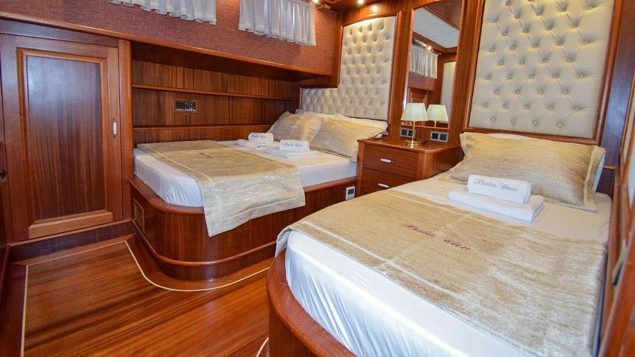 a couple of beds in a hotel room aboard BABACAN Yacht for Charter