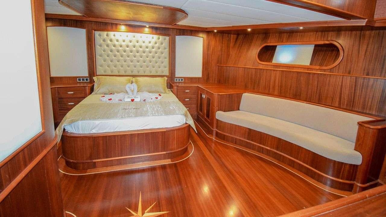 a room with two beds aboard BABACAN Yacht for Charter