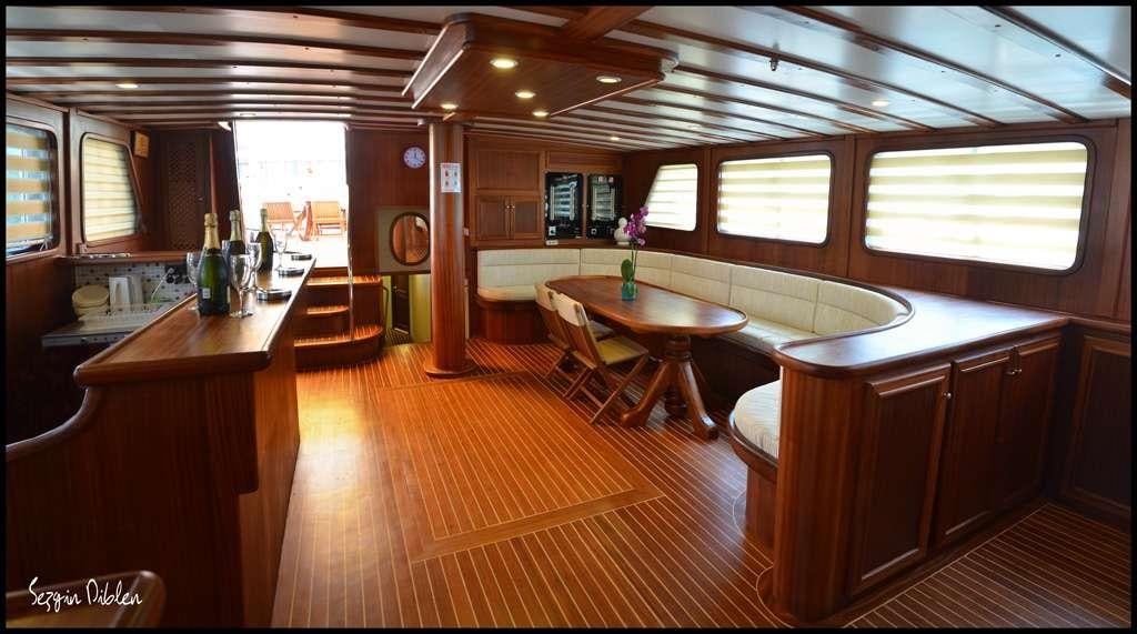 a large room with a table and chairs aboard C. TANER 2 Yacht for Charter