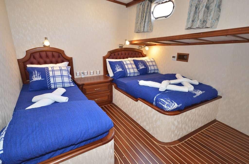 a couple of beds in a hotel room aboard C. TANER 2 Yacht for Charter