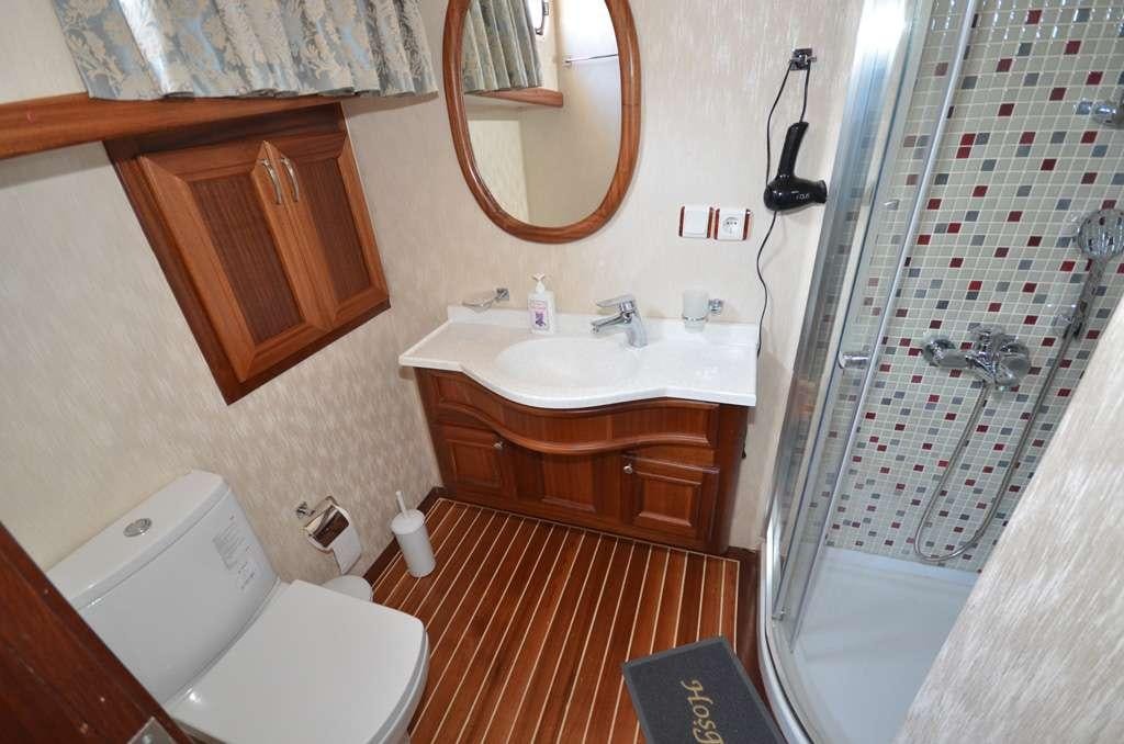 a bathroom with a sink toilet and a shower aboard C. TANER 2 Yacht for Charter