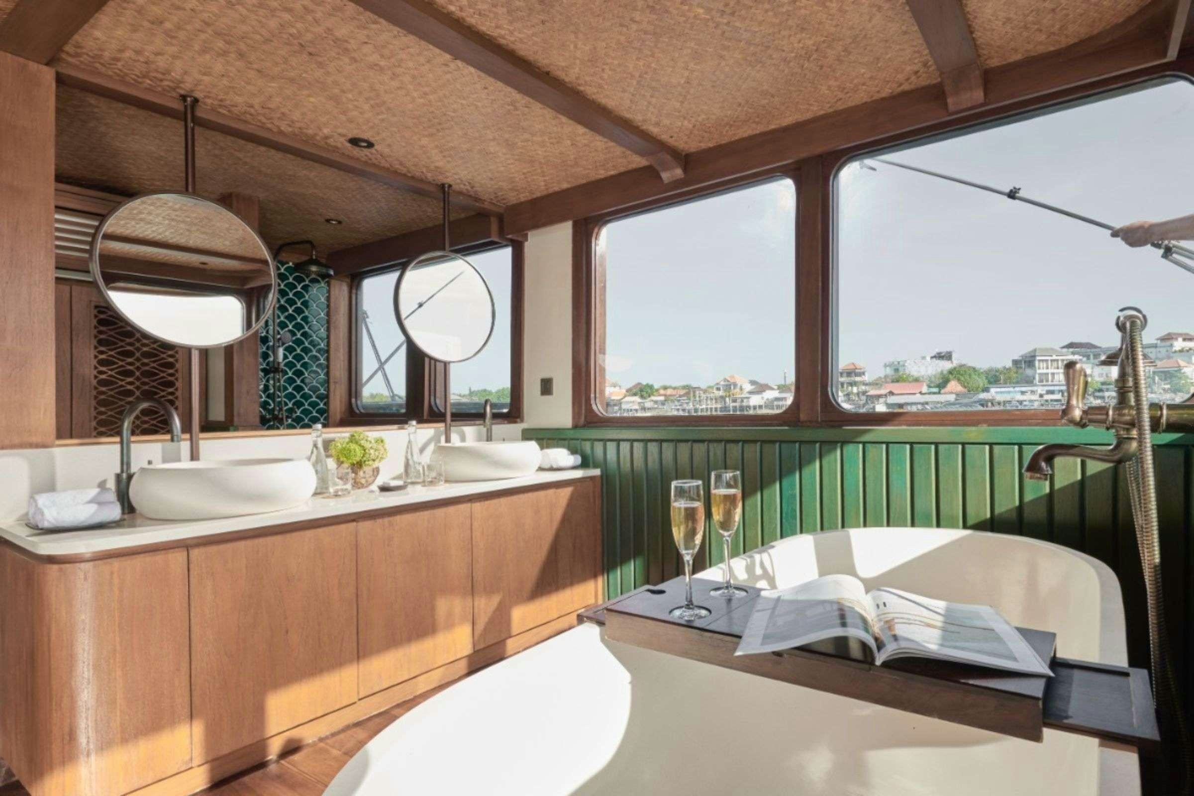 a bathroom with a large window aboard SAMSARA SAMUDRA Yacht for Charter