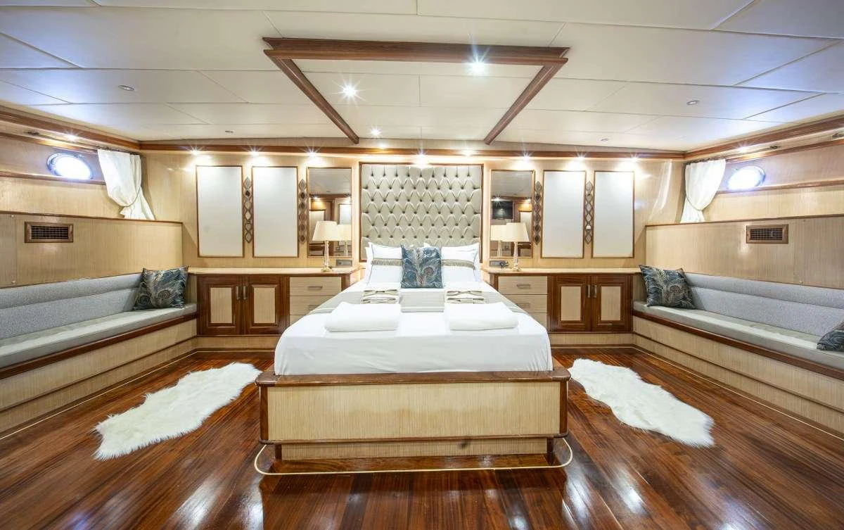 a room with a couple of beds aboard KAAN AYAZ Yacht for Charter