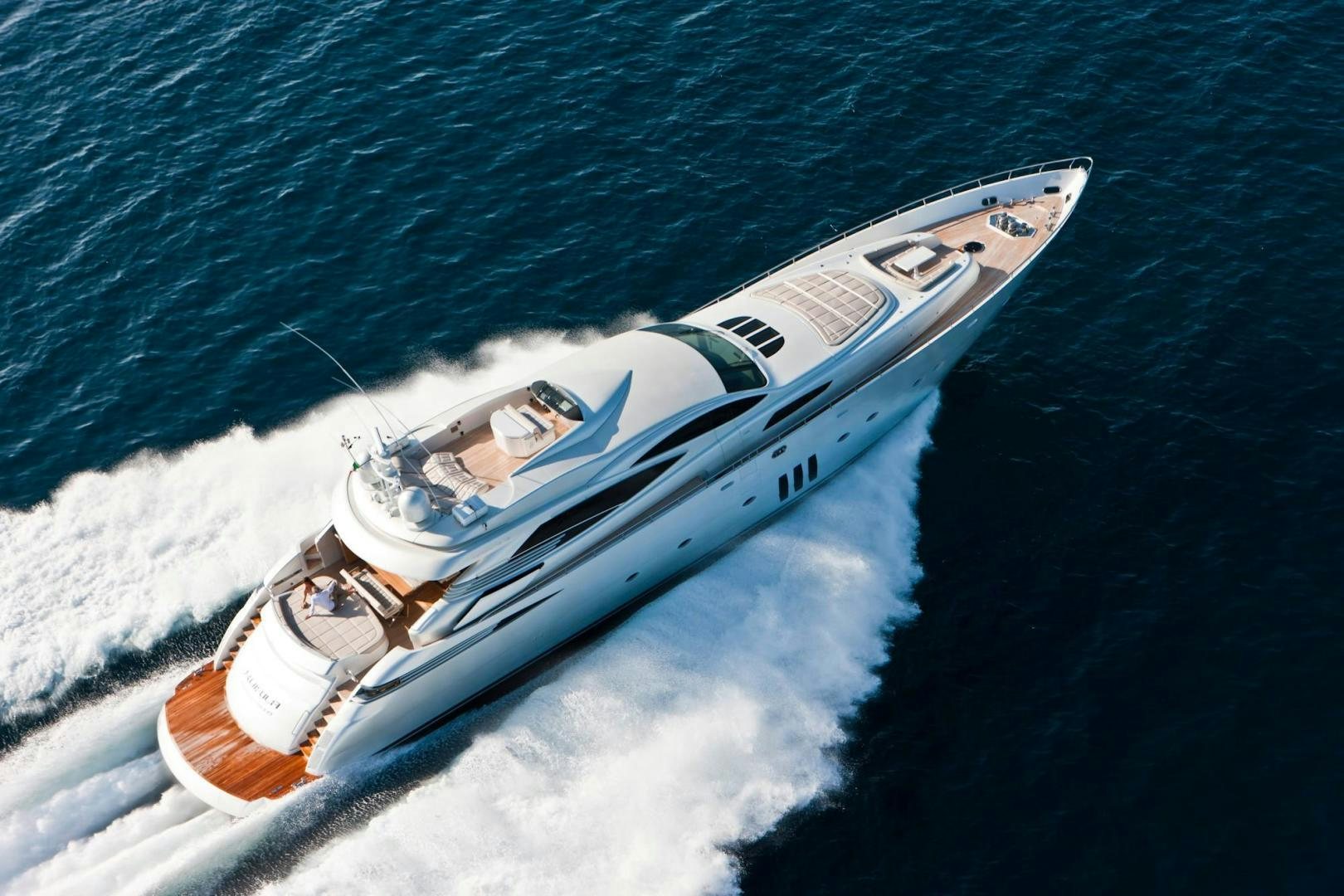 a white boat in the water aboard KUIKILA Yacht for Sale