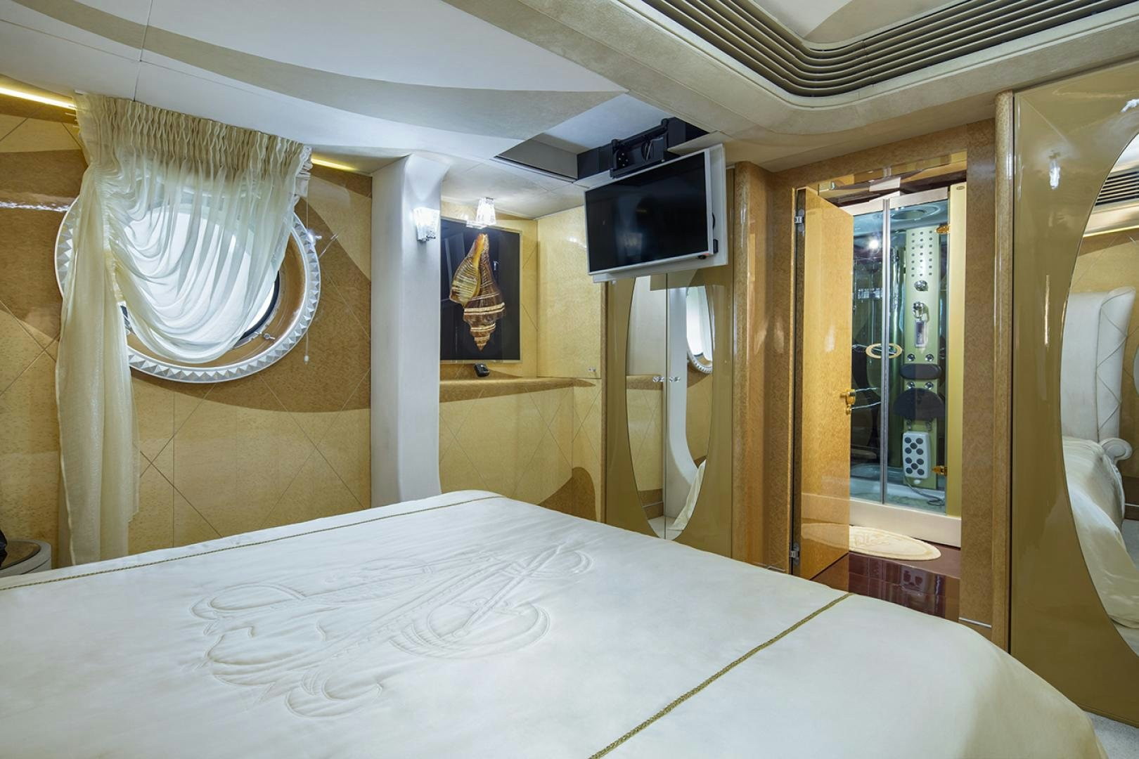 a bed with a white sheet aboard THUNDER Yacht for Sale