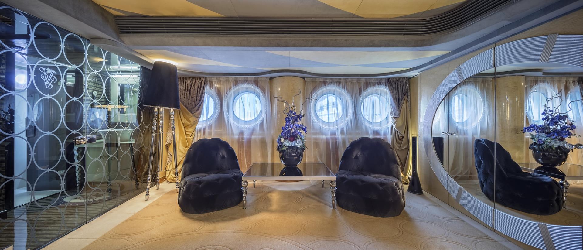 a room with a large mirror and several vases on the floor aboard THUNDER Yacht for Sale