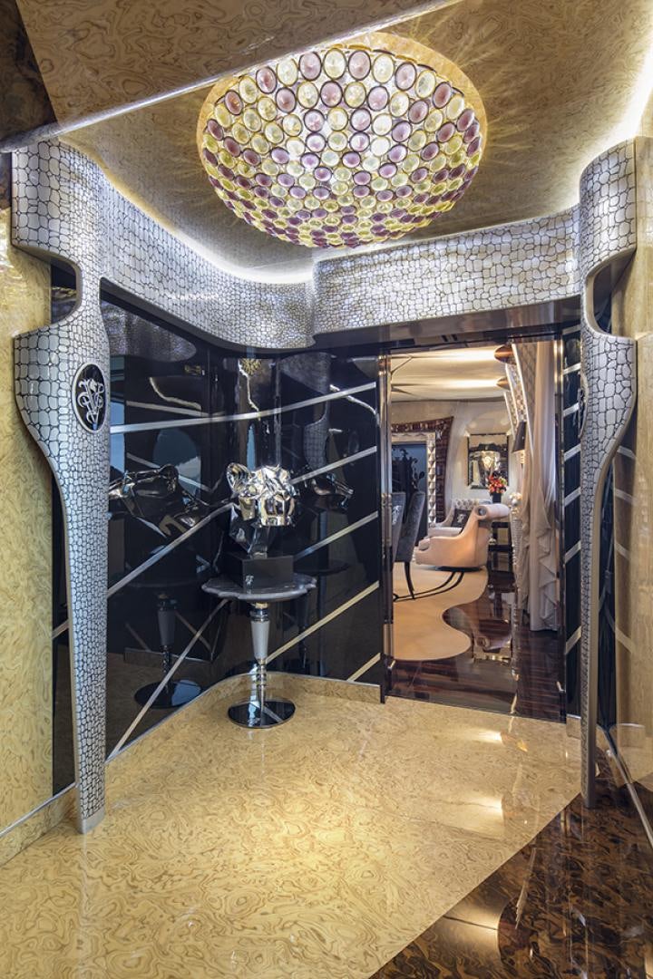 a room with a chandelier and a large mirror aboard THUNDER Yacht for Sale