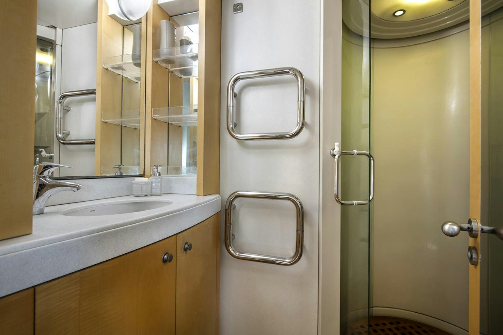 a bathroom with a sink and a mirror aboard THUNDER Yacht for Sale
