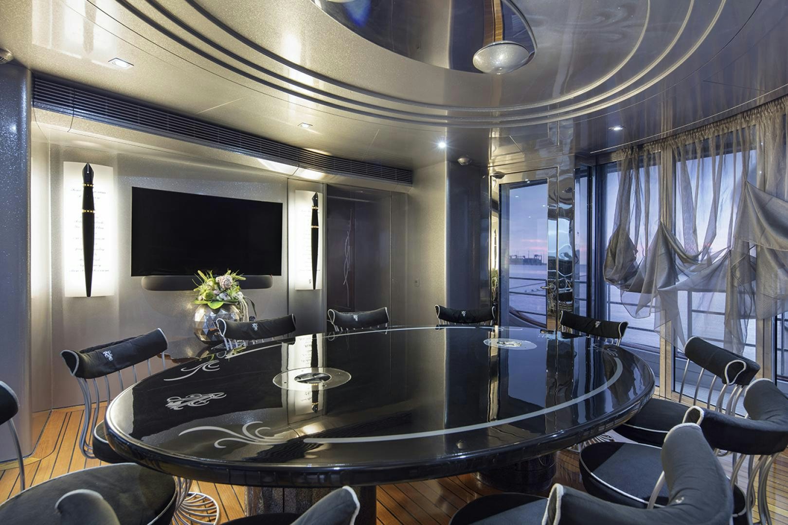 a room with a table and chairs aboard THUNDER Yacht for Sale
