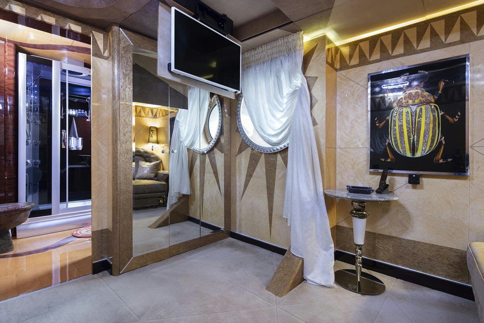 a room with a bed and a table aboard THUNDER Yacht for Sale