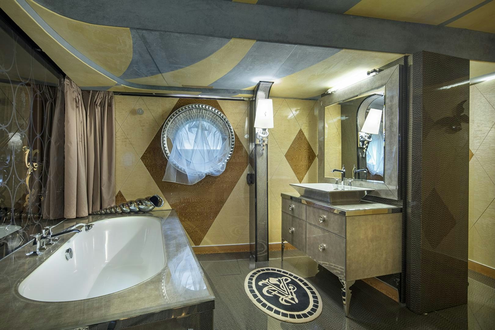 a bathroom with a large mirror aboard THUNDER Yacht for Sale