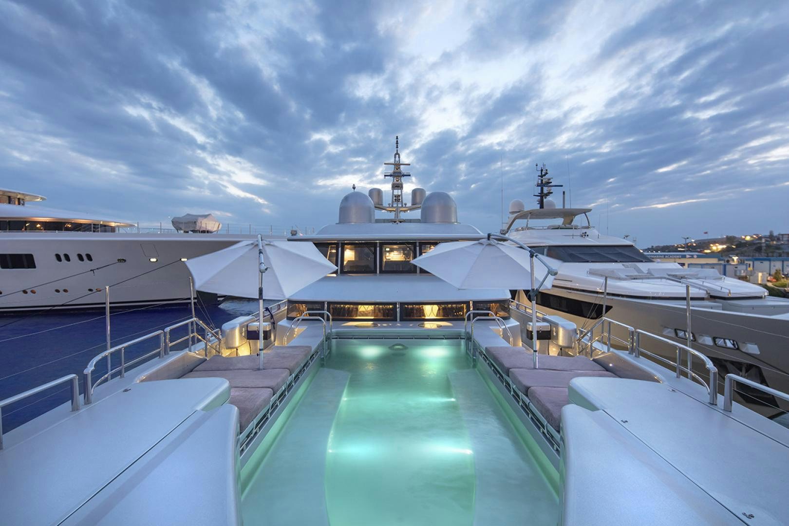 a large cruise ship docked aboard THUNDER Yacht for Sale