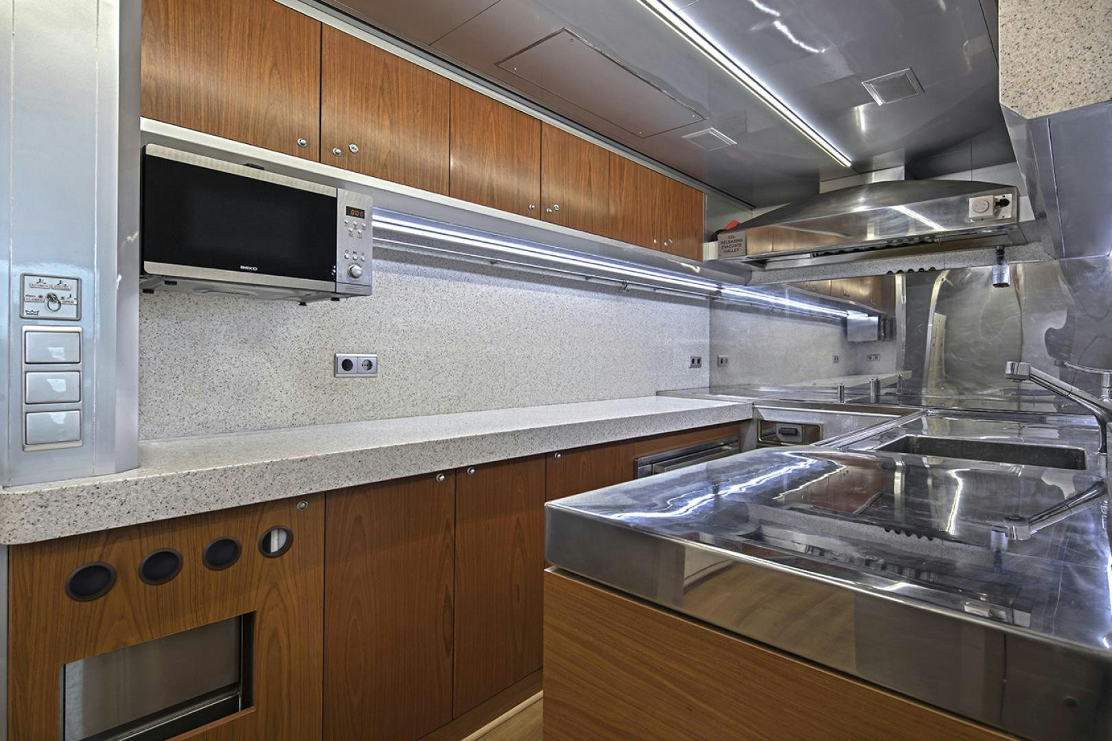 a kitchen with stainless steel appliances aboard THUNDER Yacht for Sale