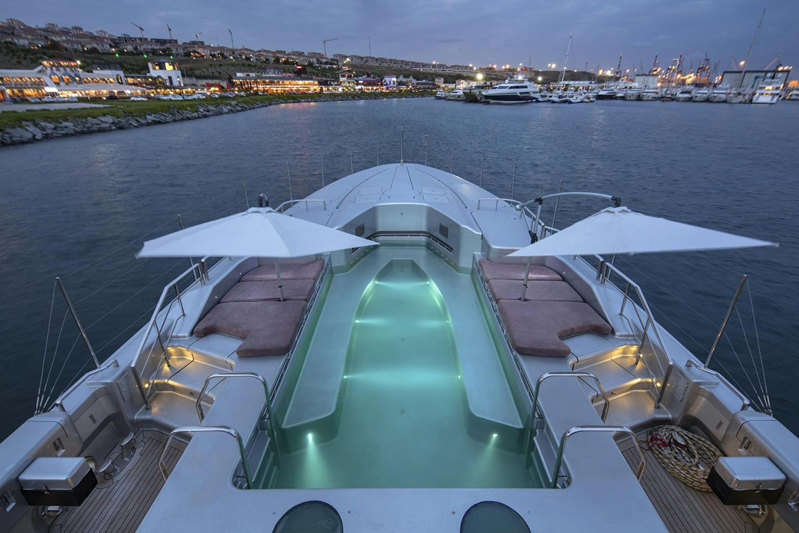 a large cruise ship docked aboard THUNDER Yacht for Sale