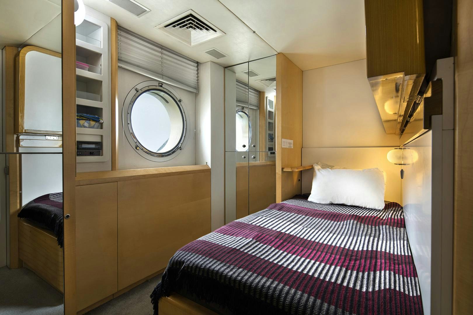a bed in a room aboard THUNDER Yacht for Sale