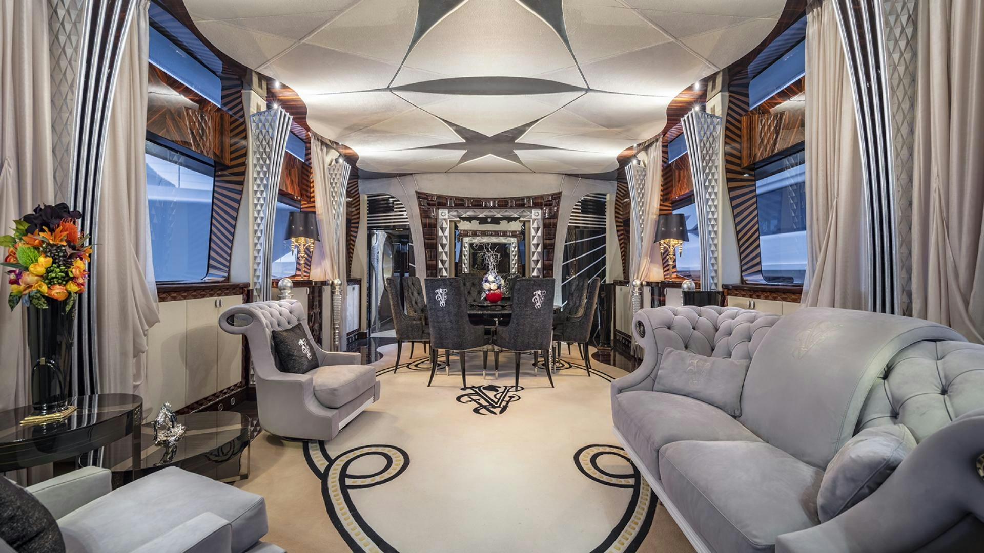 a living room with a couch and chairs aboard THUNDER Yacht for Sale