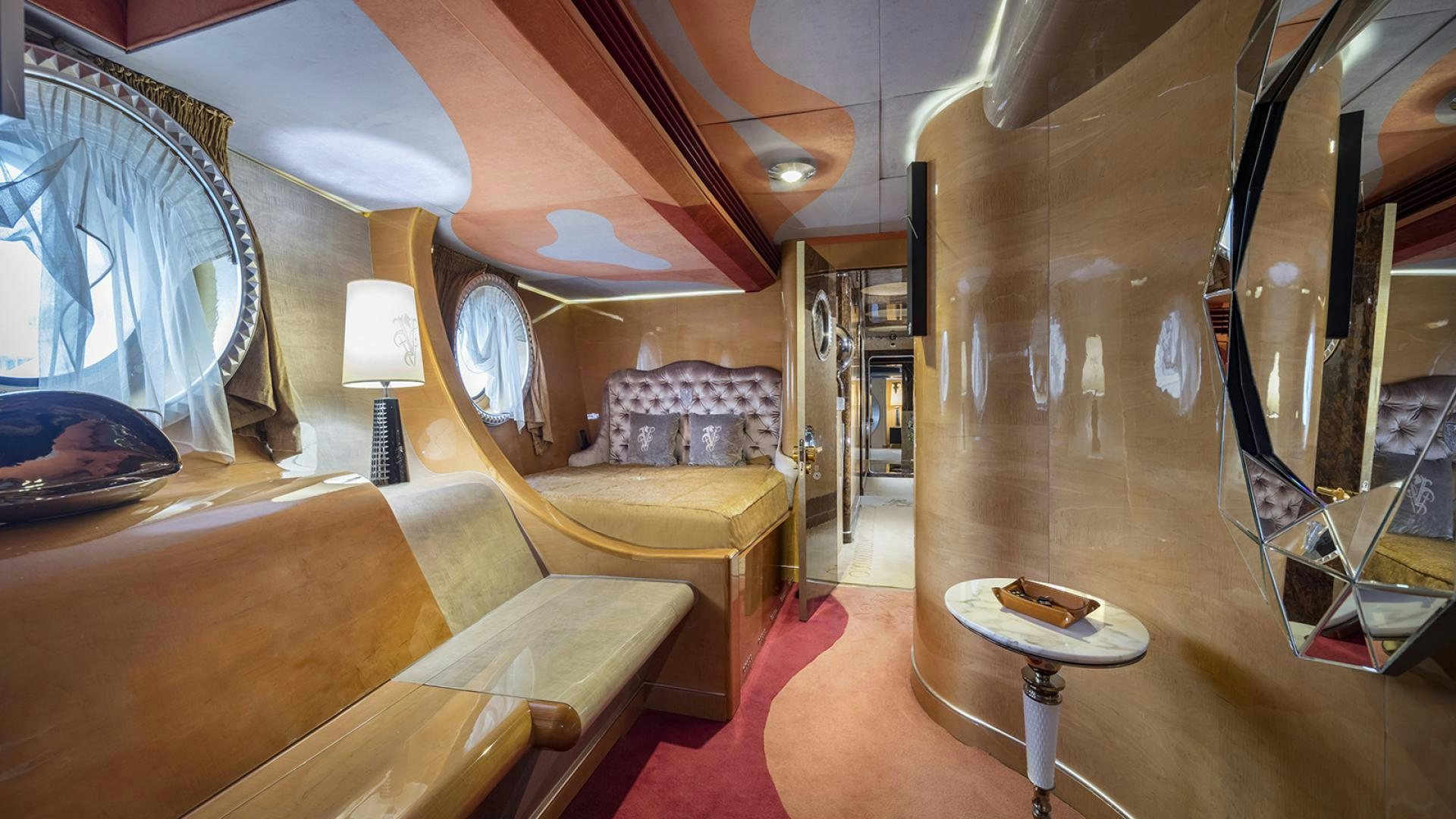 a room with a couch and a table aboard THUNDER Yacht for Sale