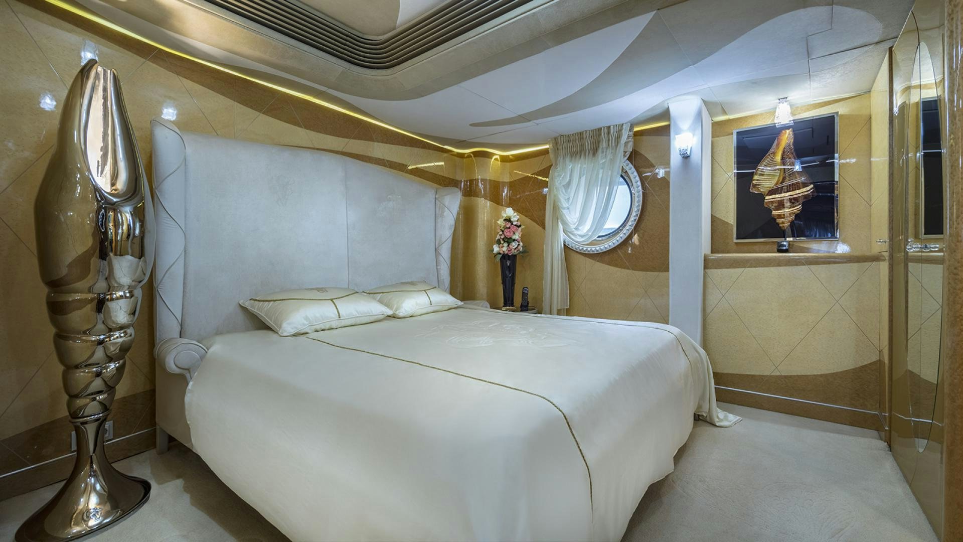 a bed with a white bed spread aboard THUNDER Yacht for Sale