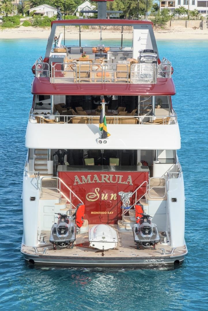 a boat with a red banner on the front aboard AMARULA SUN Yacht for Sale