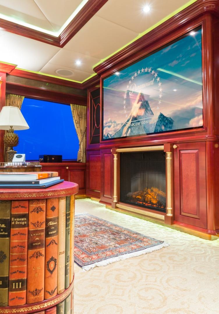 a room with a fireplace and a tv aboard AMARULA SUN Yacht for Sale