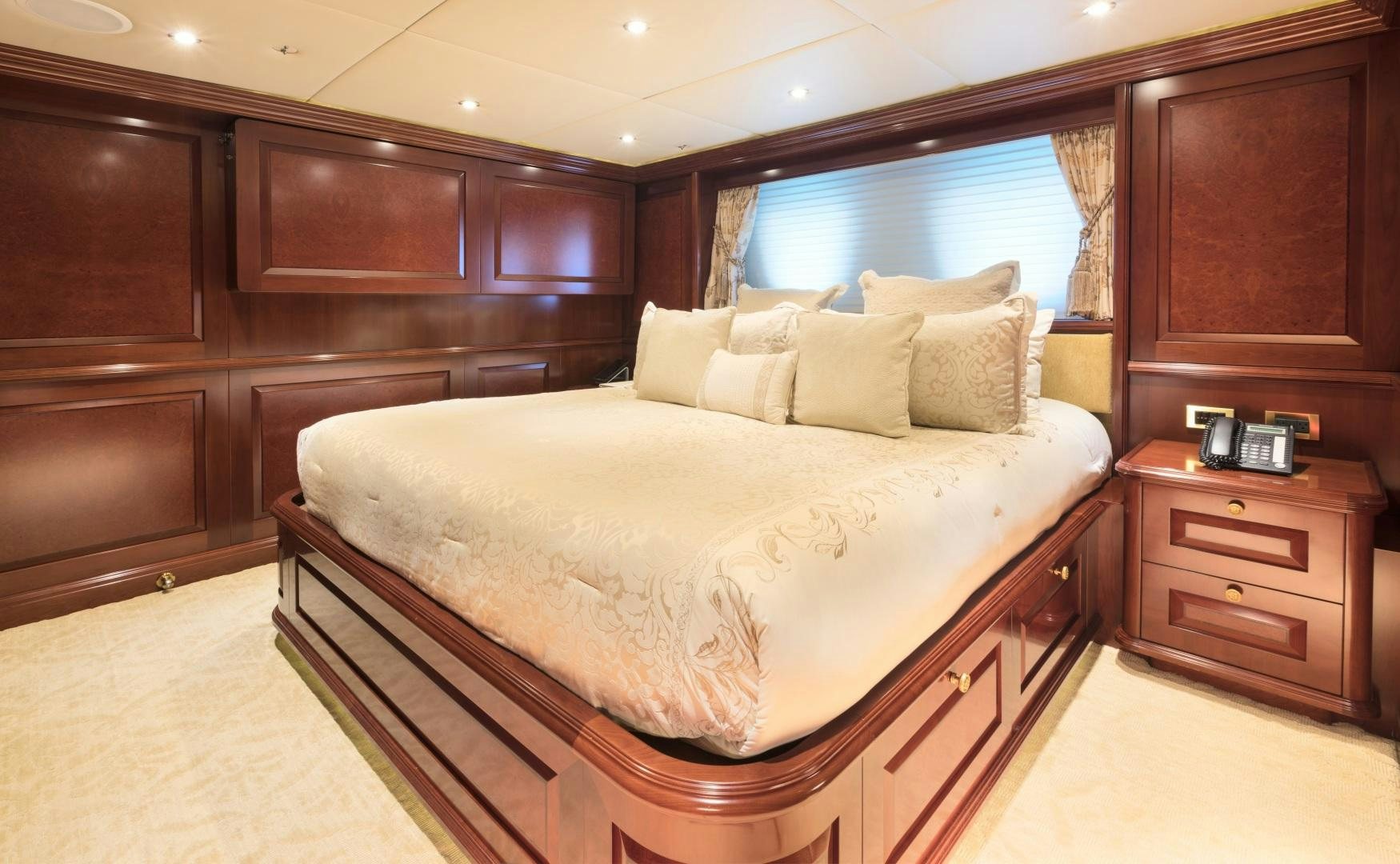a bed in a room aboard AMARULA SUN Yacht for Sale