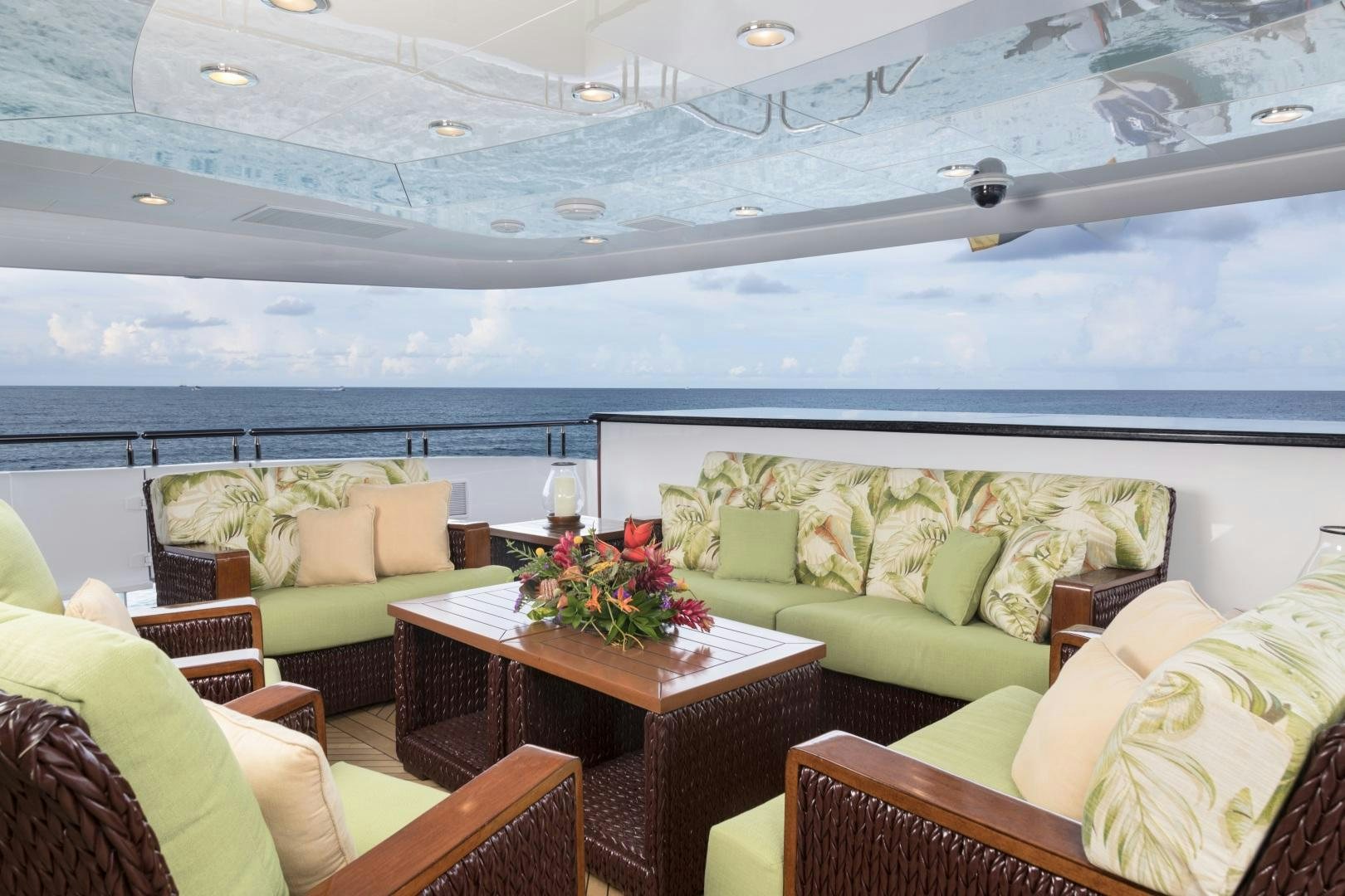 a room with couches and a table aboard AMARULA SUN Yacht for Sale