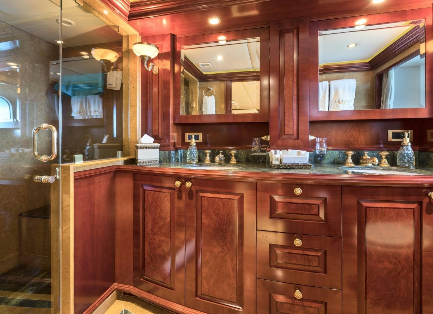 a kitchen with wooden cabinets aboard AMARULA SUN Yacht for Sale