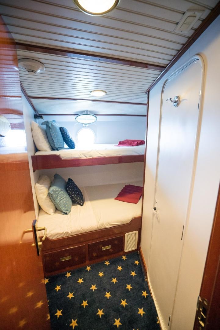 a room with bunk beds aboard ARABELLA II Yacht for Sale